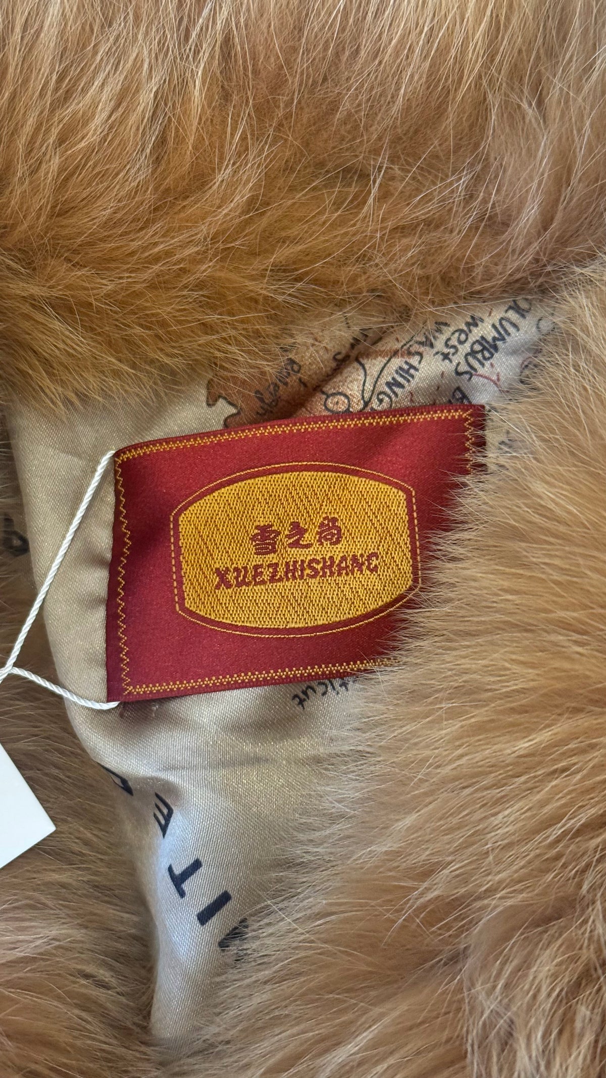 Golden brown fox fur jacket - label