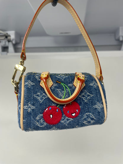 Louis Vuitton x TM Cherry Micro Speedy Bag Charm with Strap, original box, and duster