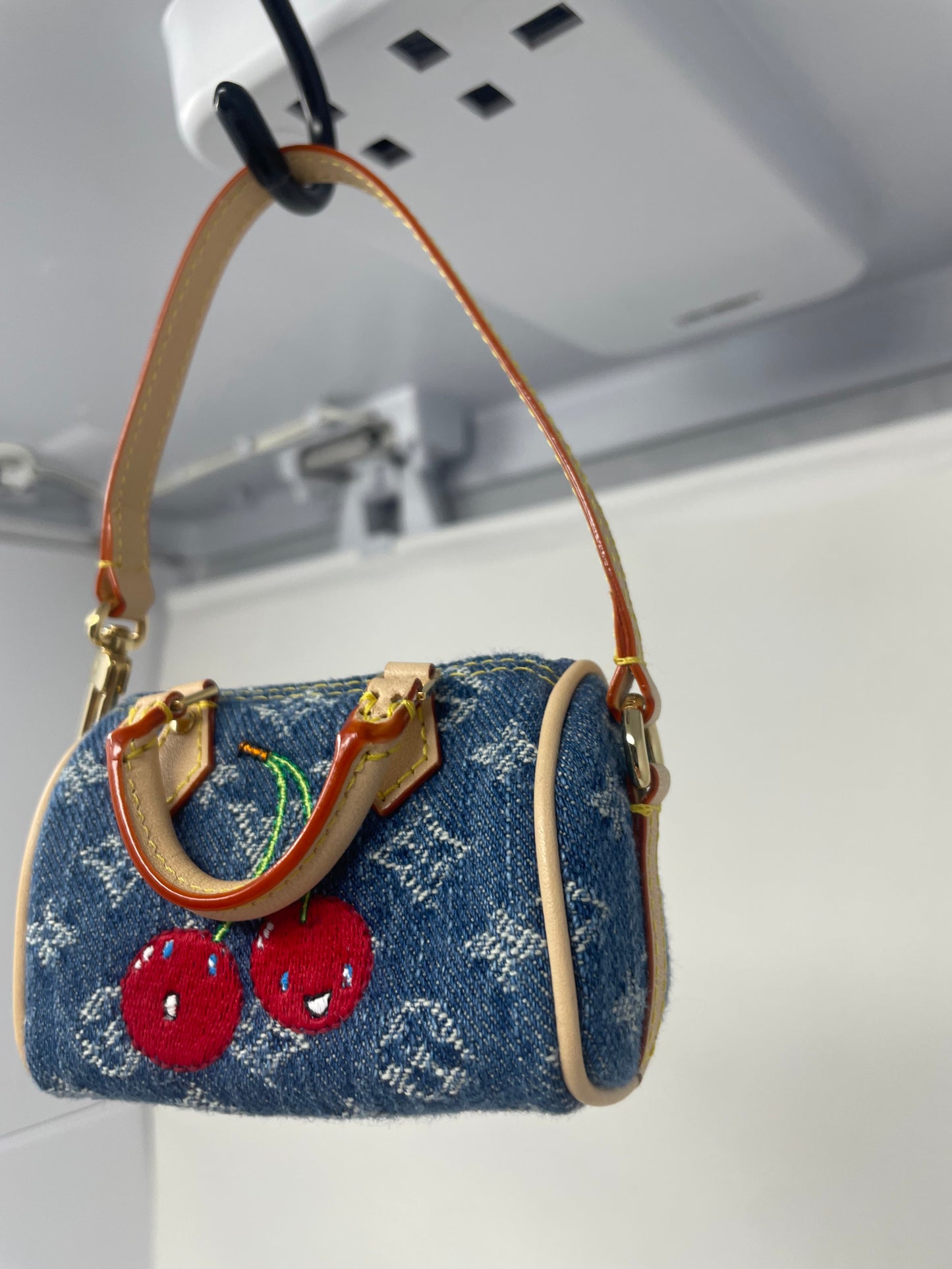 Louis Vuitton x TM Cherry Micro Speedy Bag Charm with Strap, original box, and duster